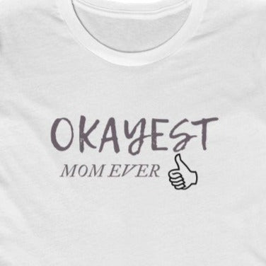 White Tee shirt with grey wording: Okayest mom ever with a thumbs up